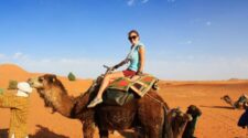 riding a camel in the sahara desert