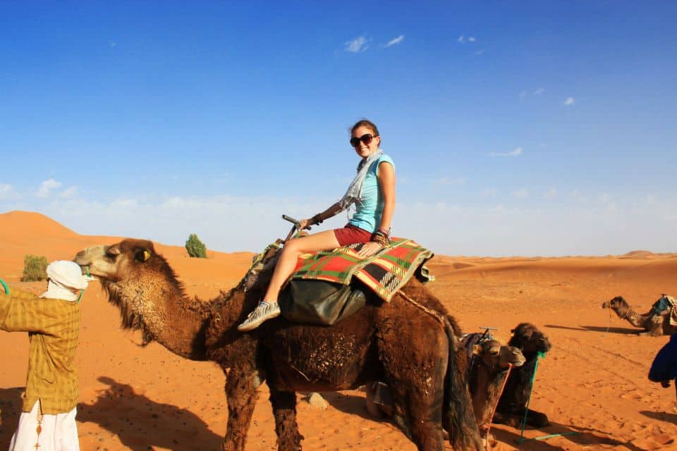 riding a camel in the sahara desert