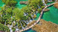 Plitvice Lakes from above with people on the walkway