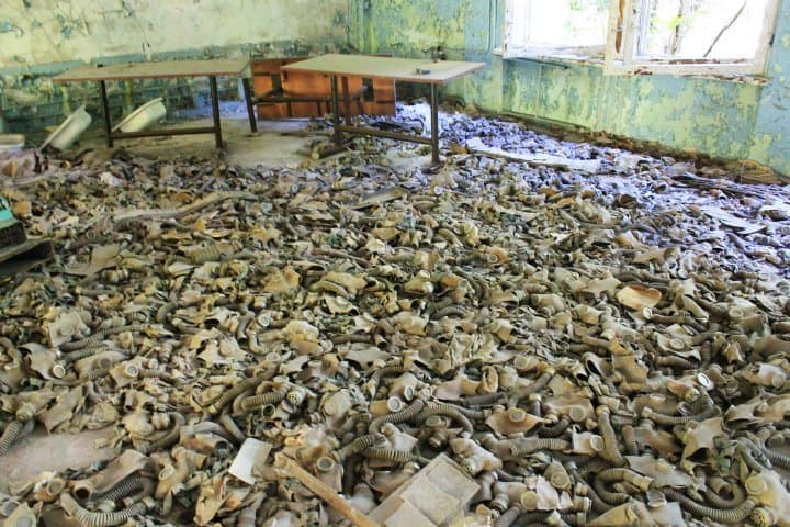 creepy room filled with gas masks