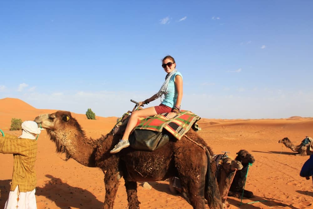 riding a camel in the sahara