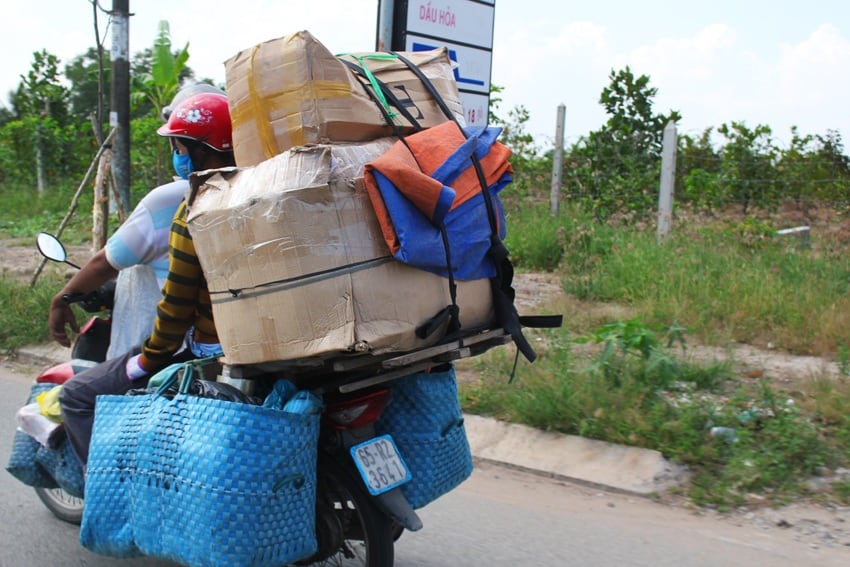 overpacked scooter in vietnam