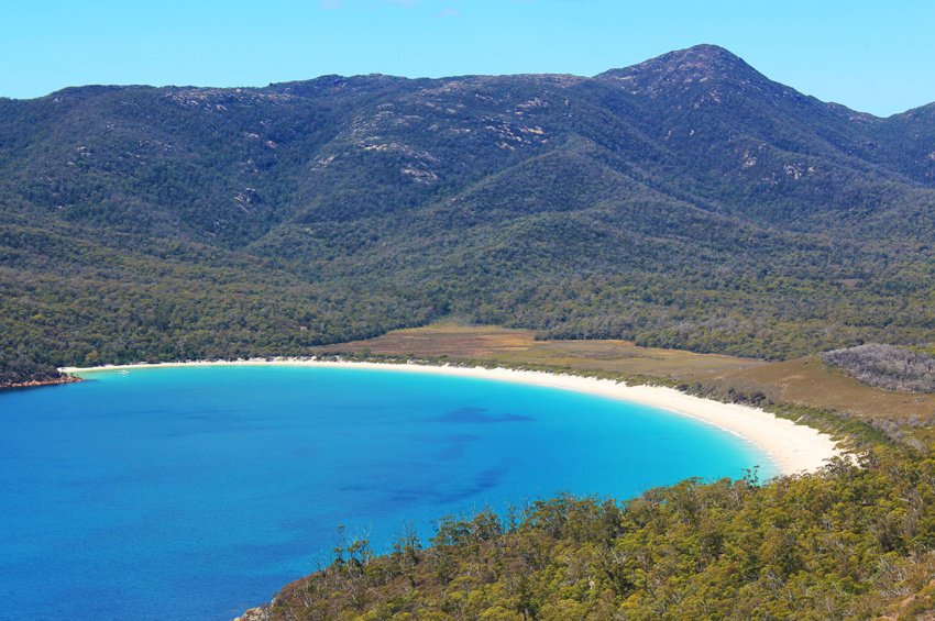 View of Wineglass Bay from lookout on sunny day