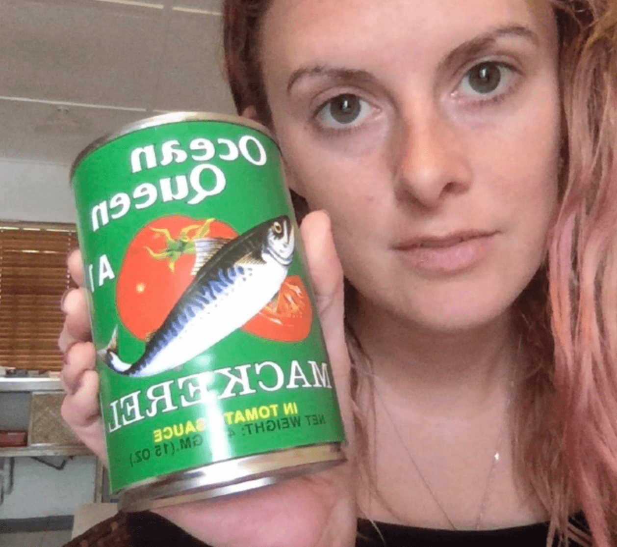 Girl with a can of mackerel