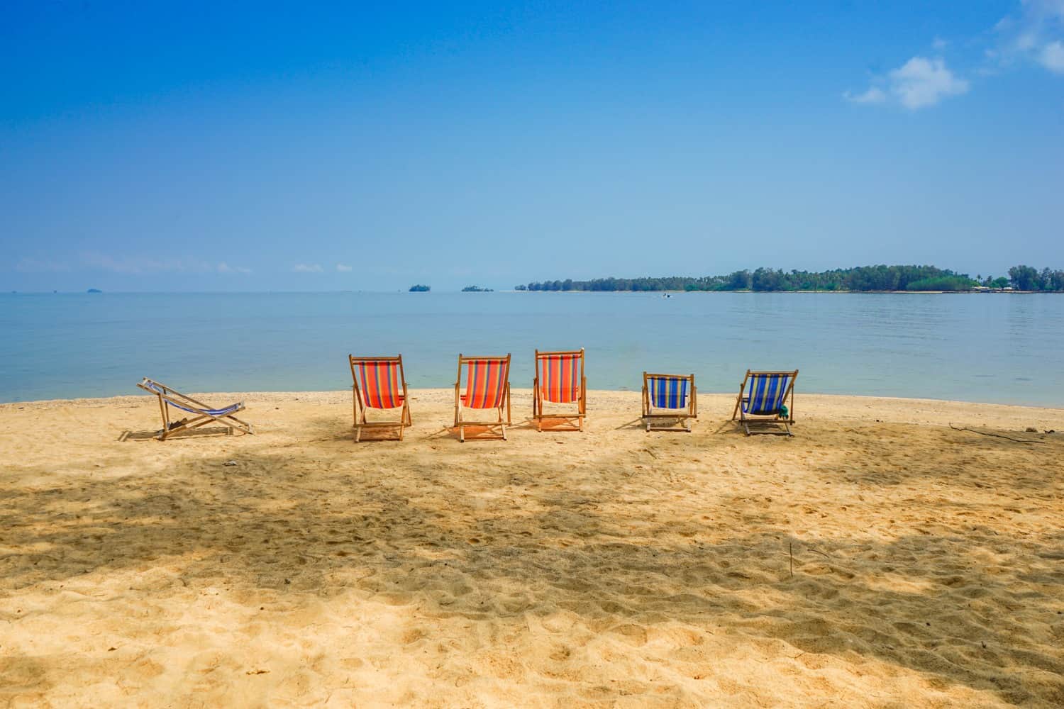 Deckchairs on a beach in Koh Mak_