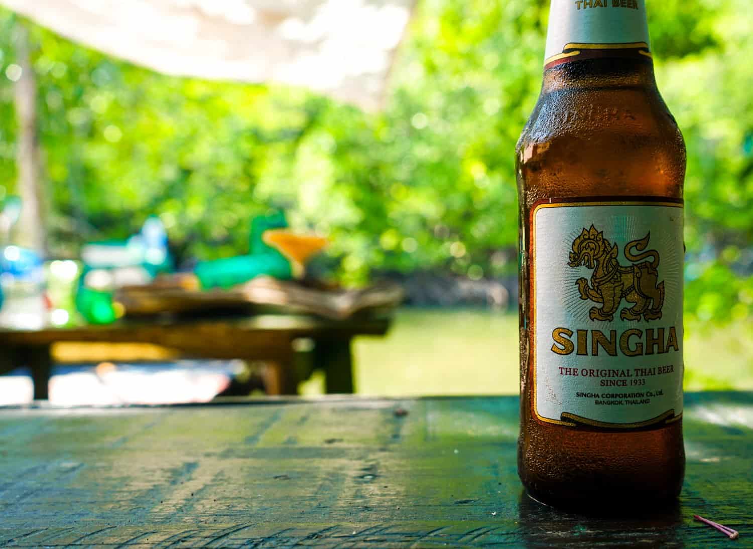 Close-up of Singha beer bottle