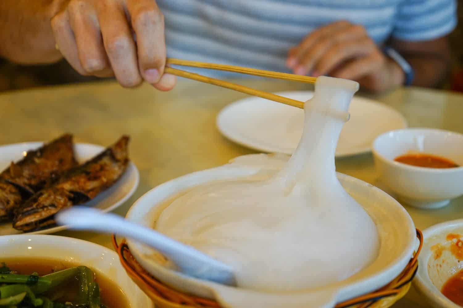 Man eating ambuyat