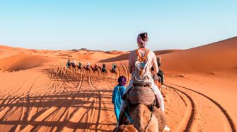 Sahara desert girl on camel