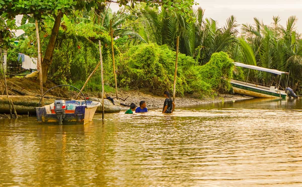 Children playing in the river in Borneo