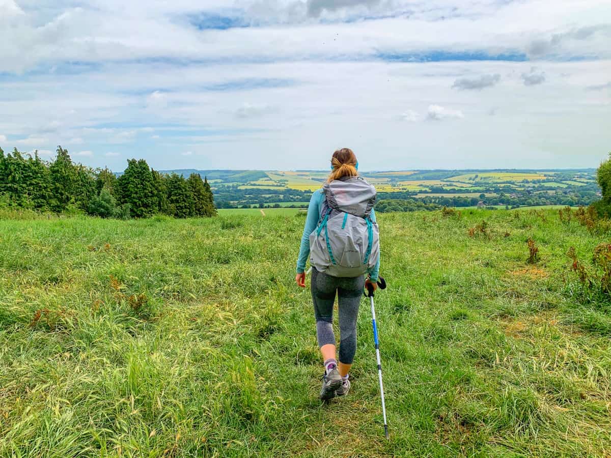 Girl walking in English countryside