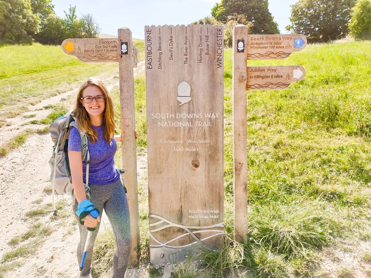 Girl with South Downs Way sign