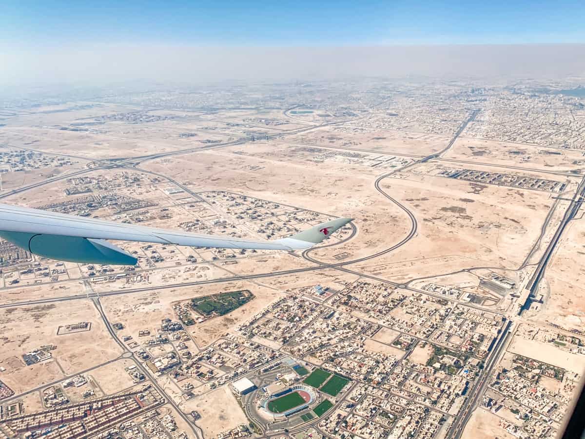 Views from my plane window over Qatar. There are miles of sand stretching towards the horizon with just a small patch of green marking out a football stadium