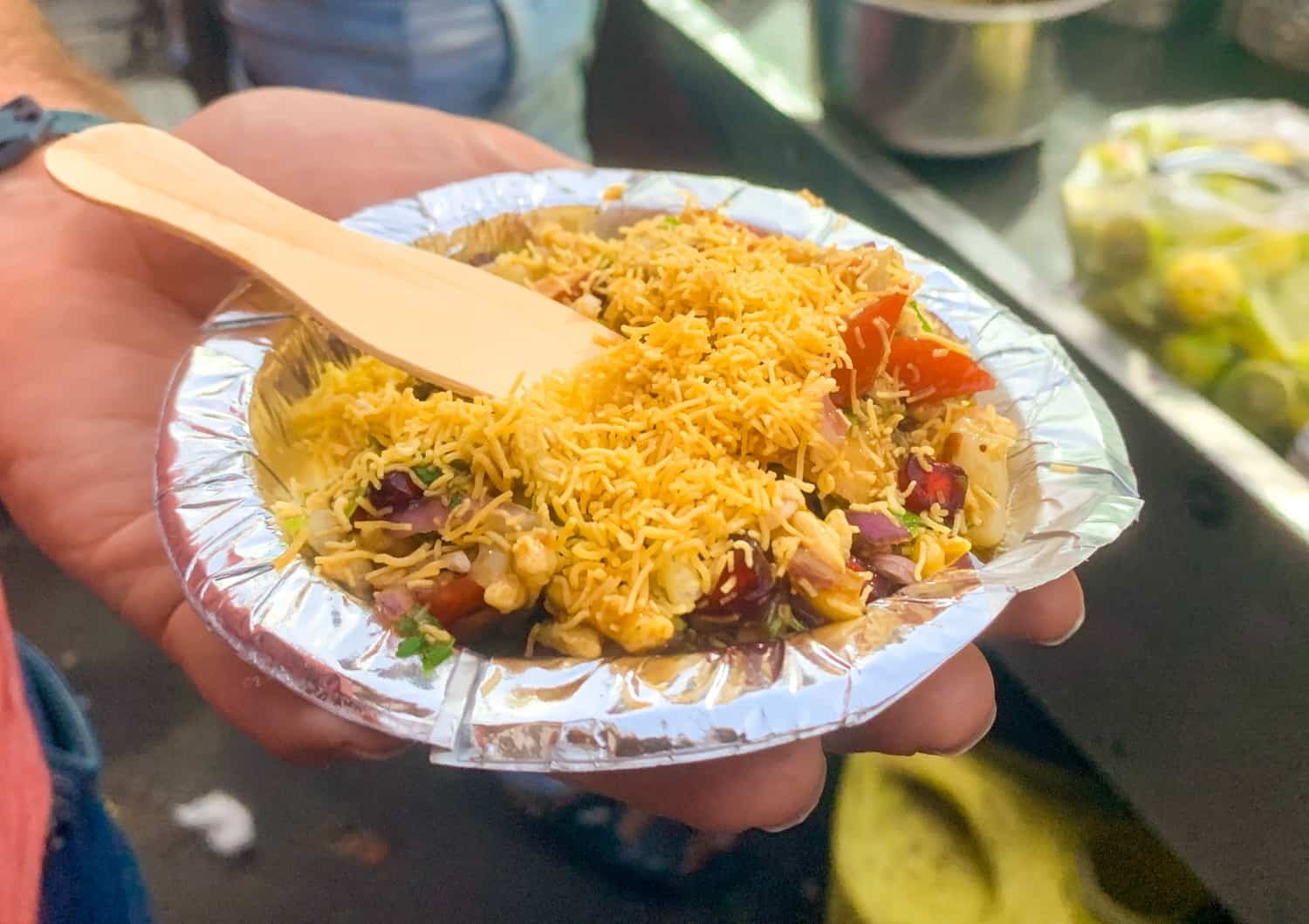 Hand holding Indian street food