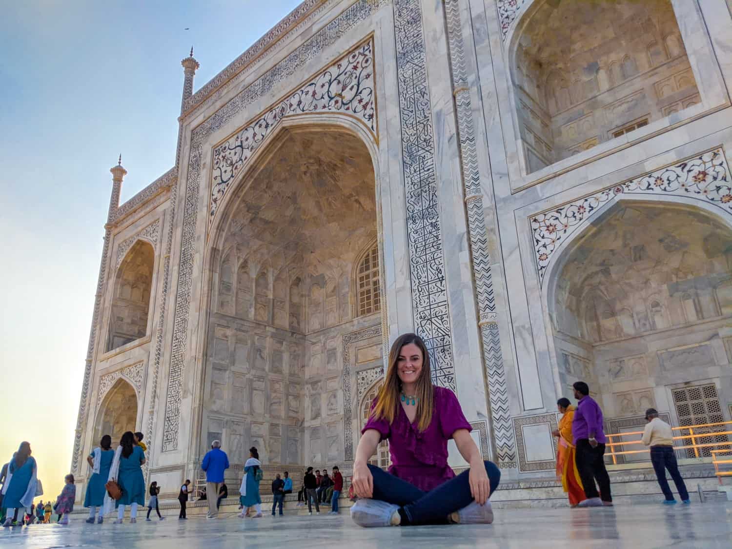 Lauren sitting in front of the Taj Mahal at sunset