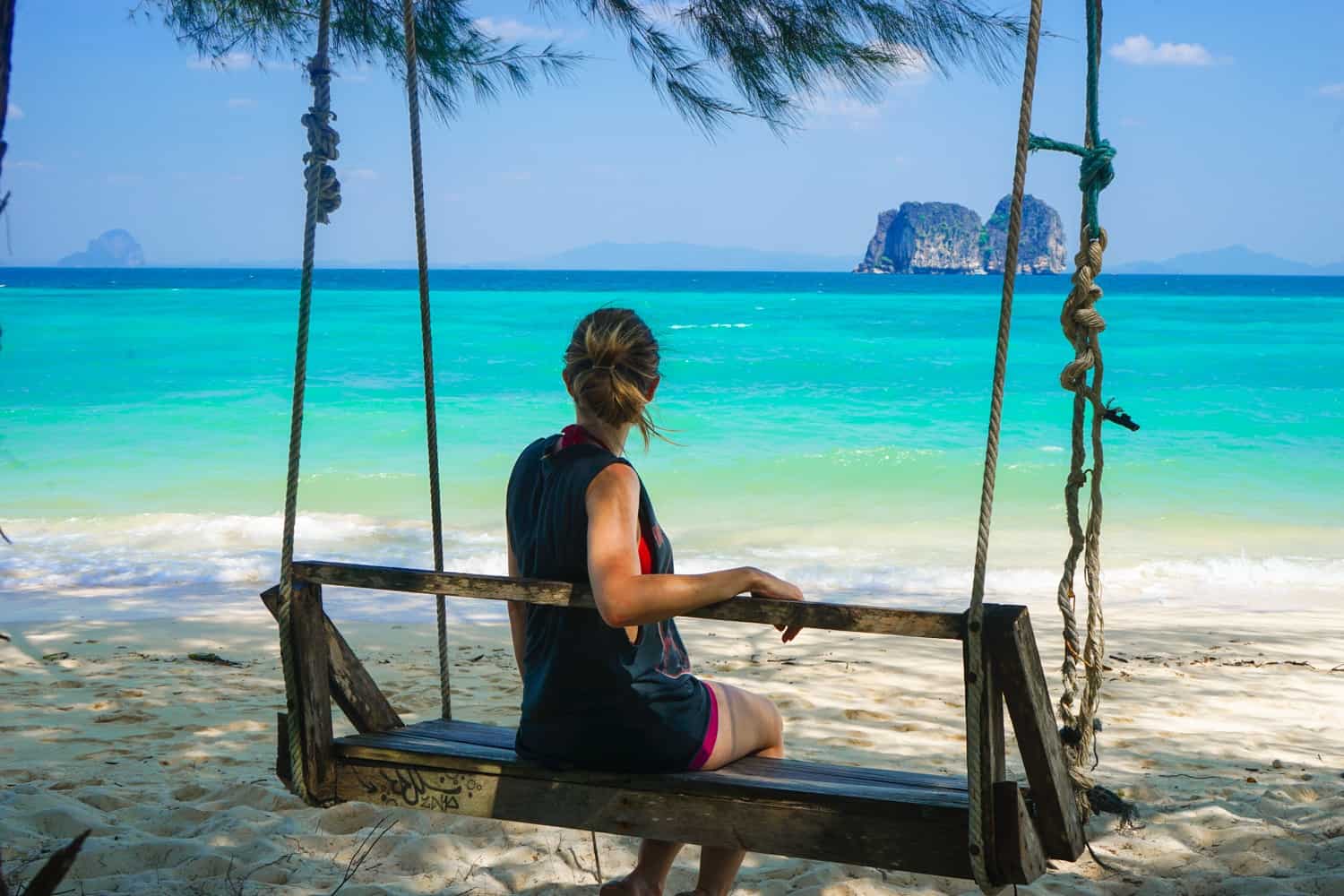 Girl on a rope swing in Koh Ngai