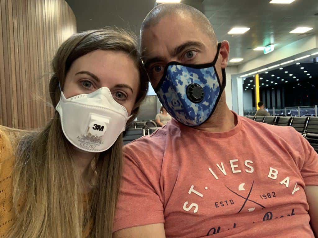 Lauren and Dave wearing face masks at Doha Airport