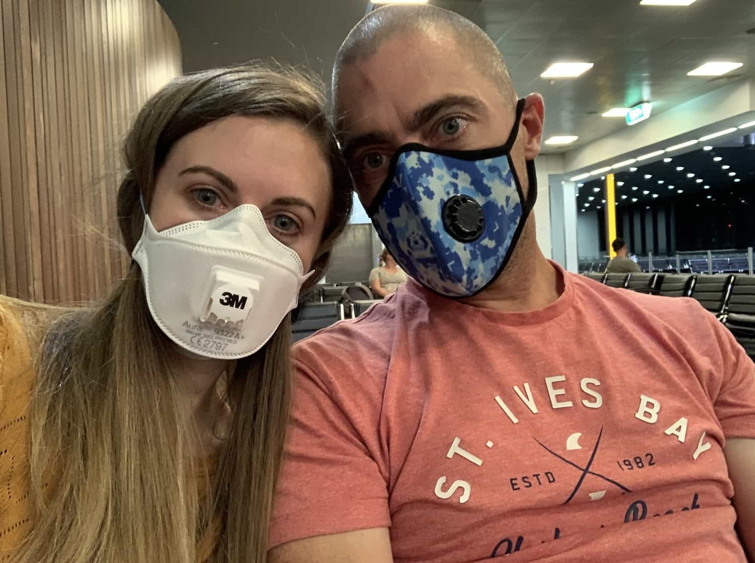 Lauren and Dave wearing face masks at Doha Airport