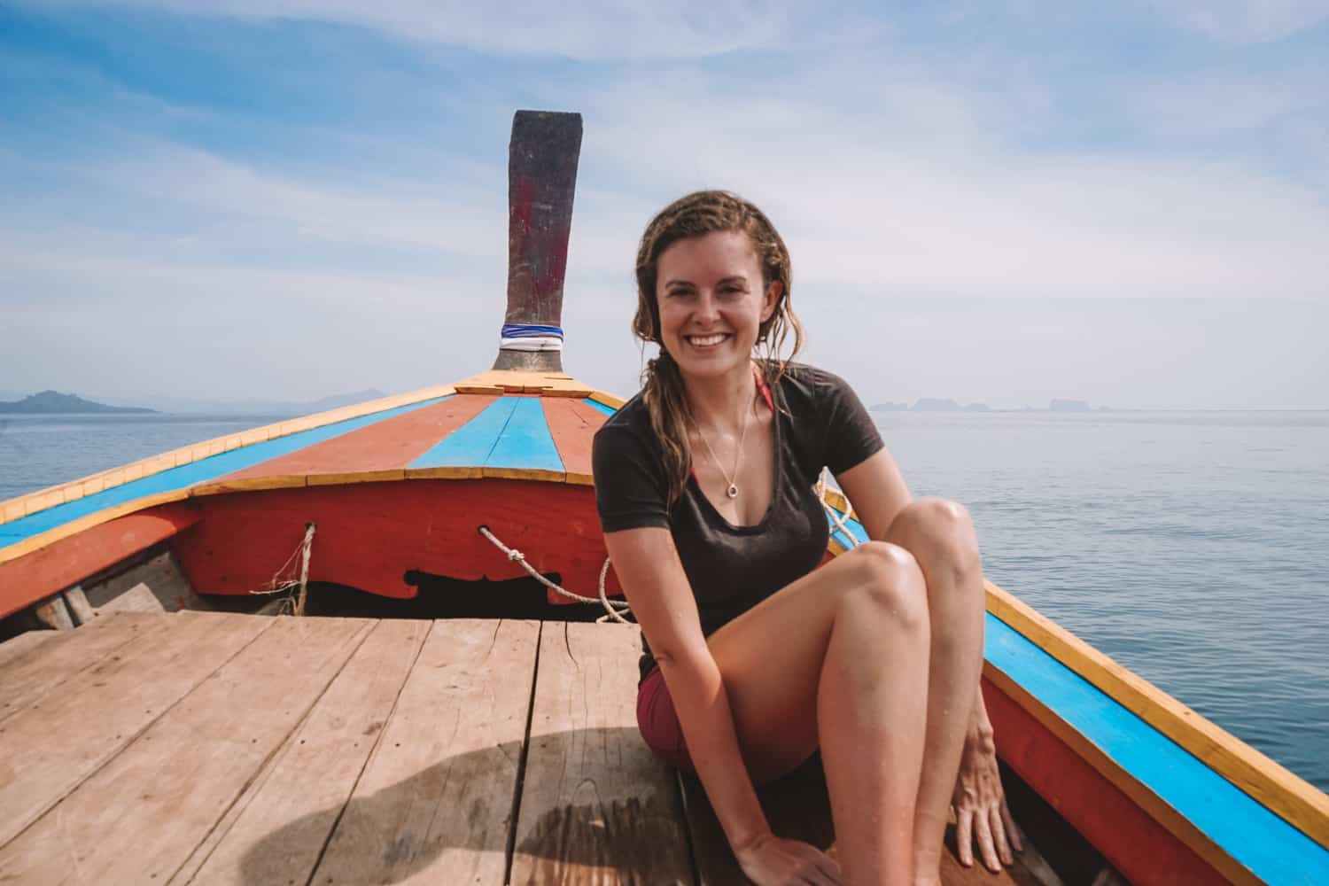 girl on a longtail boat in thailand