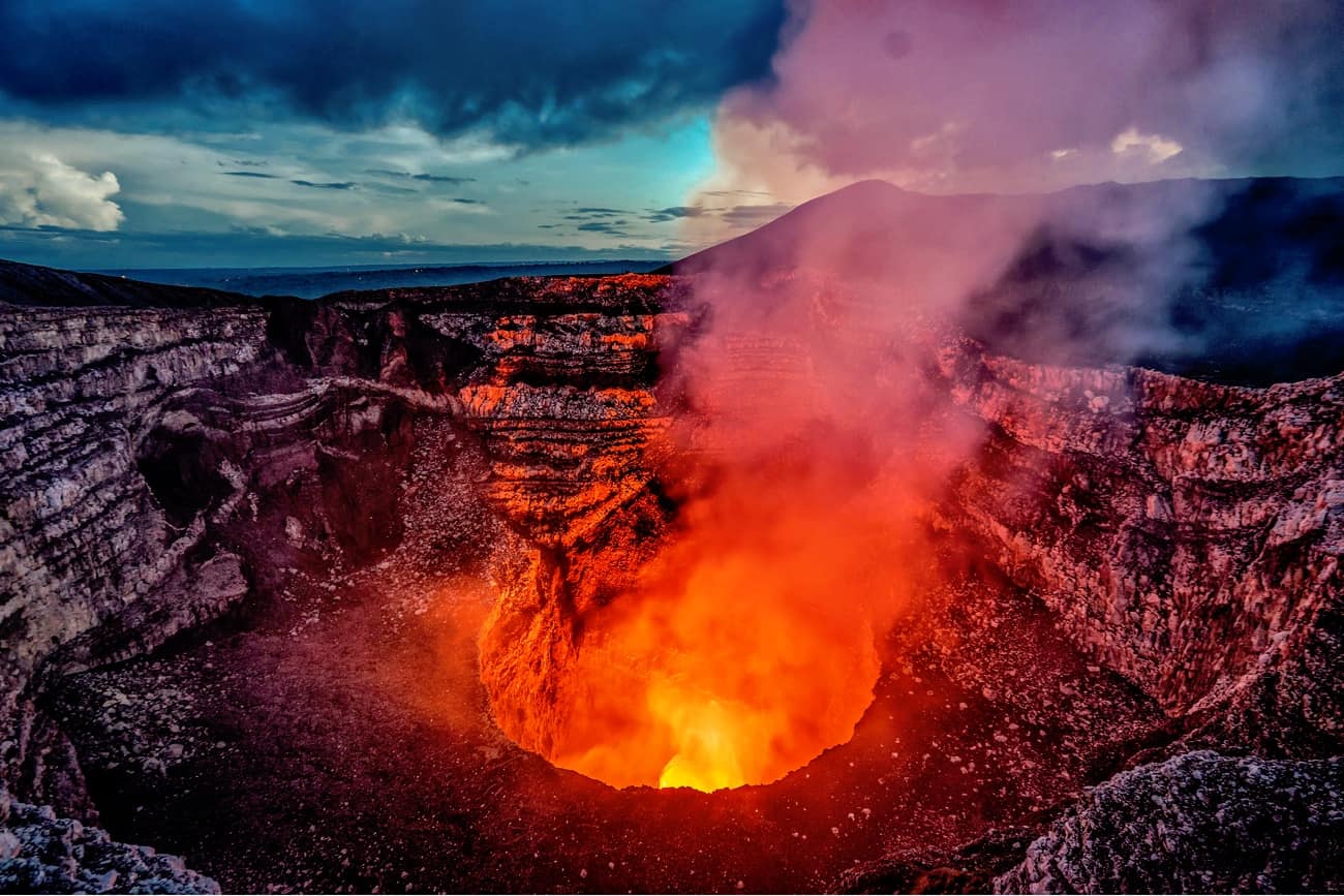 travel brochure for nicaragua A volcano in Nicaragua at night, with lava bubbling in the crater