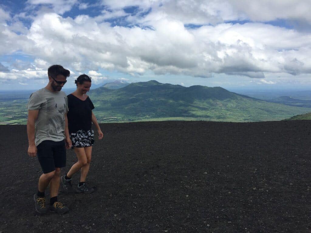 couple walking on a volcano in nicaragua
