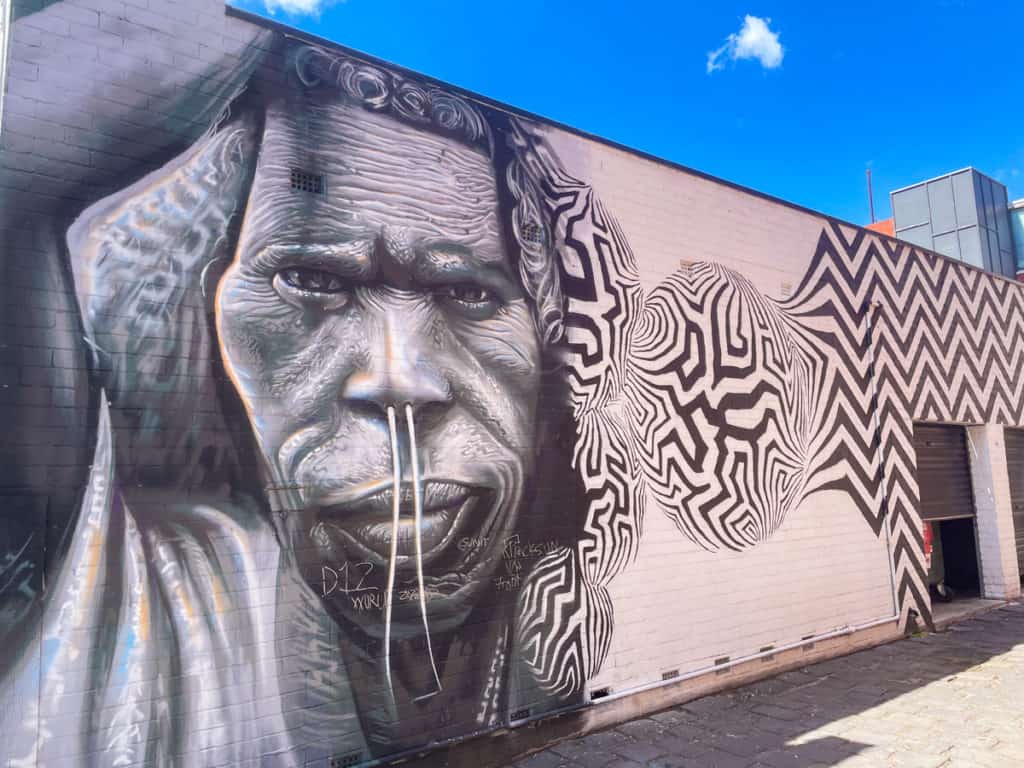 A black and white street art portrait of an aboriginal man, spotted in Central Melbourne.