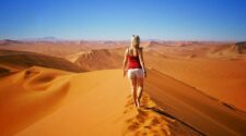 Solo woman traveler on sand dune